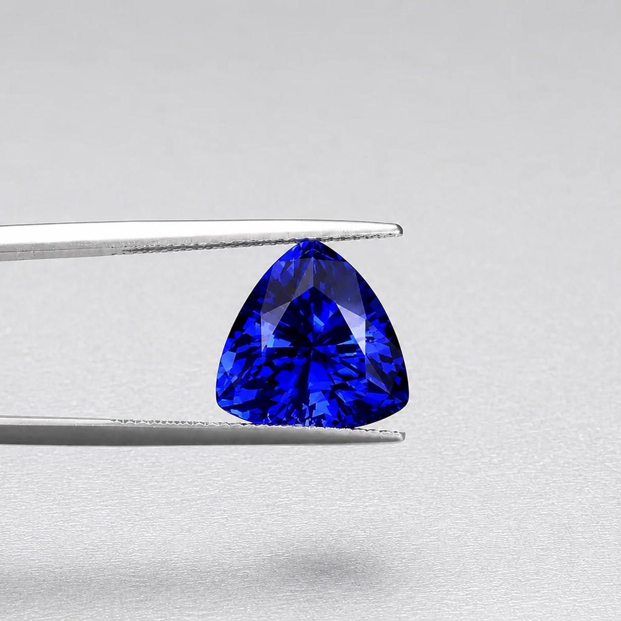 Emerald-cut tanzanite gemstone with vivid royal blue colour