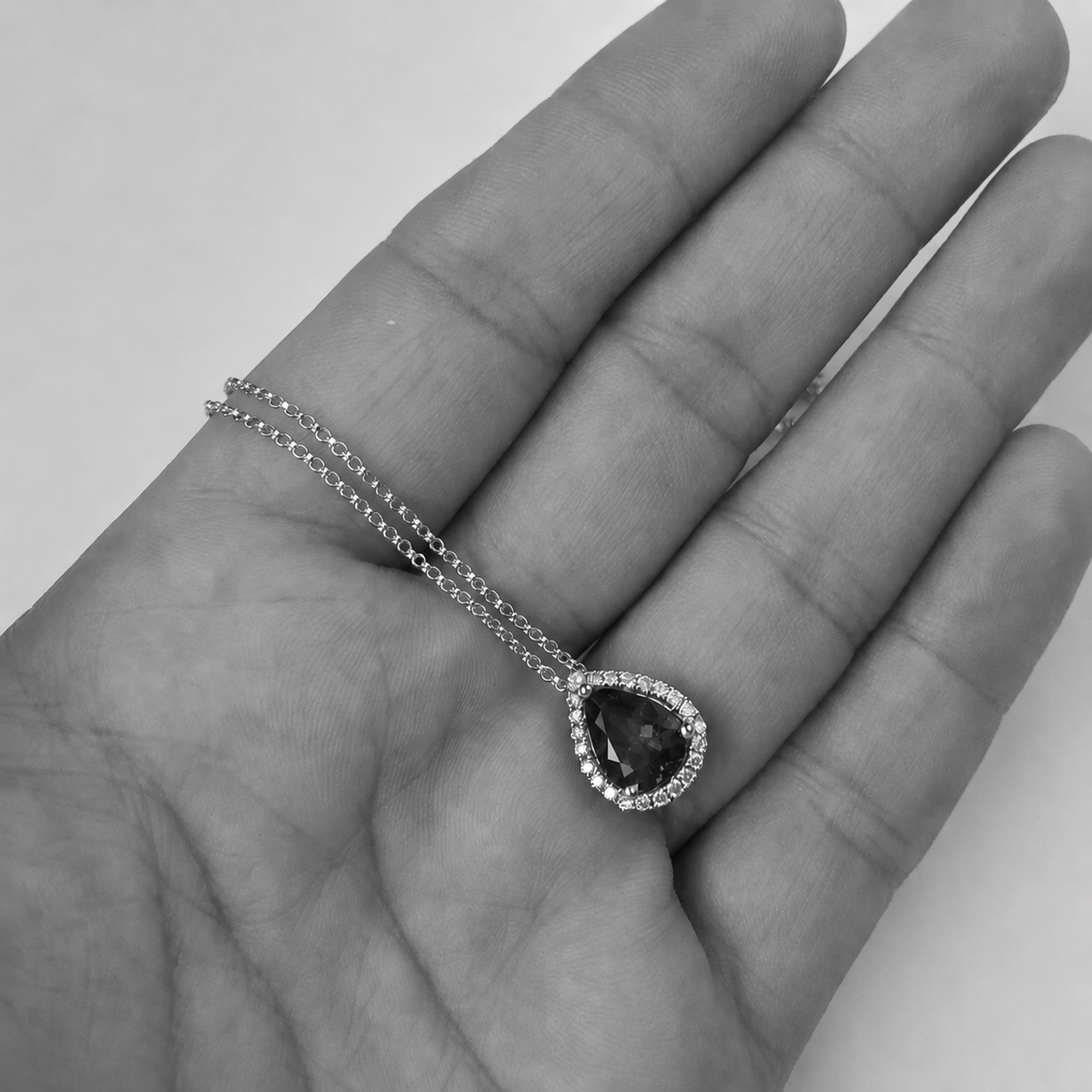 Pear-Shaped Tanzanite Pendant With Diamond Halo