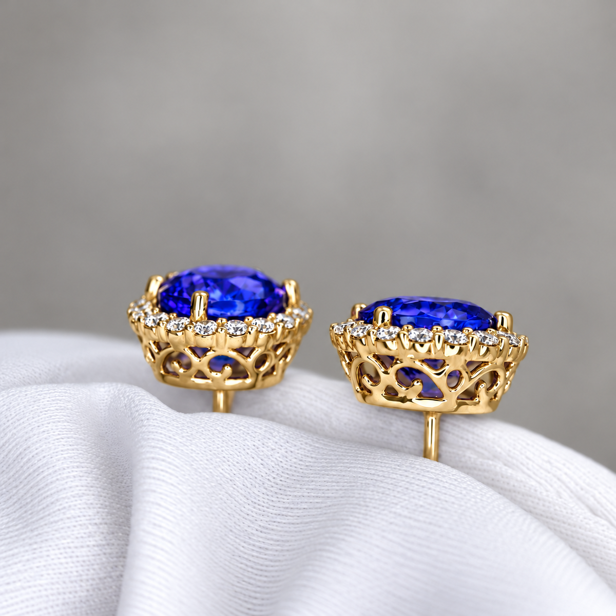 Exceptional Five Carat Tanzanite and Diamond Halo Stud Earrings – 18ct Yellow Gold