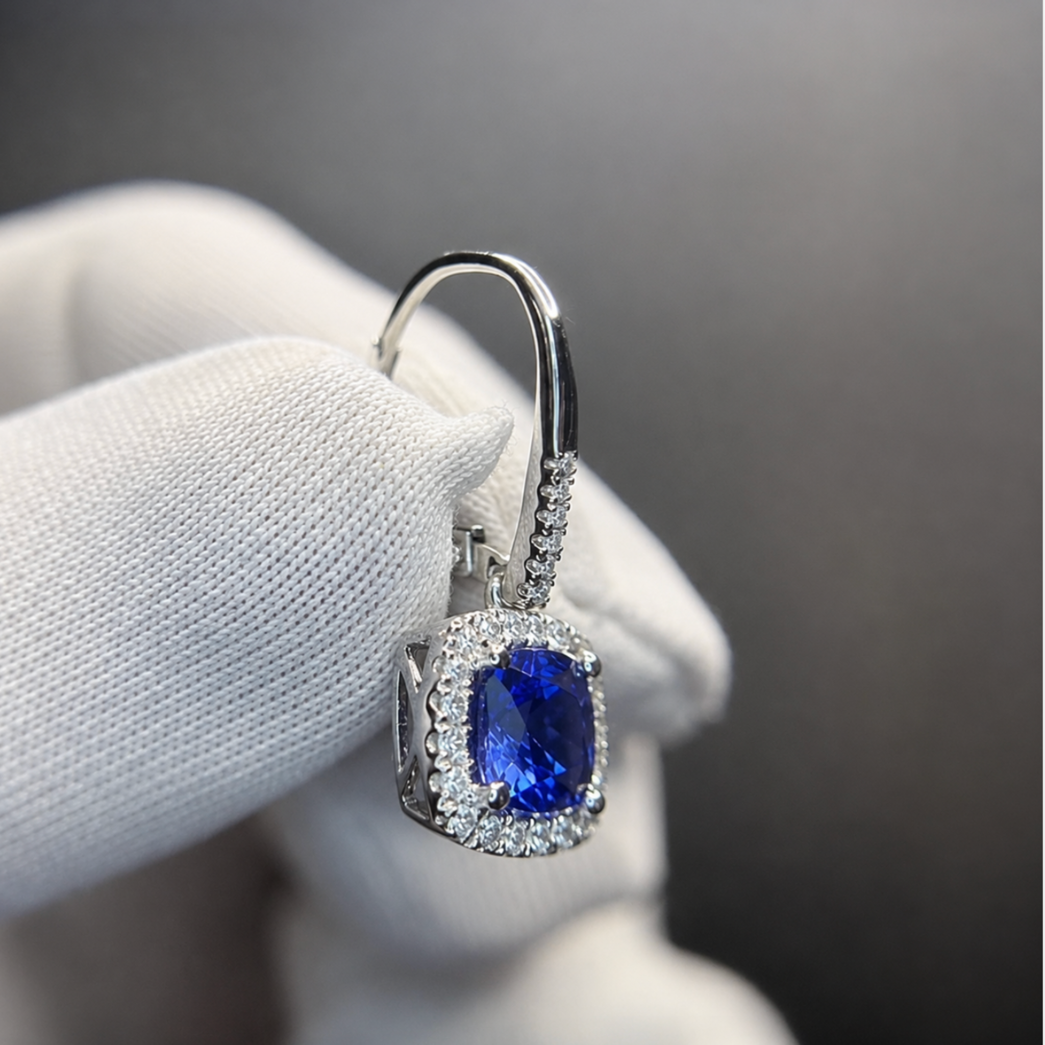 Top-grade tanzanite earrings displaying vivid blue and violet flashes