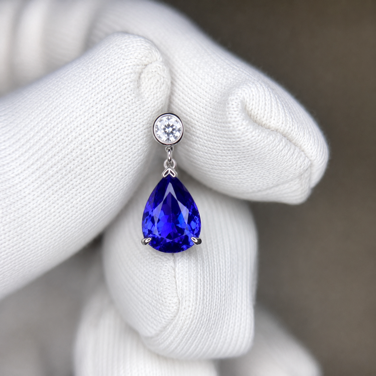 Matching pair of flawless pear-shaped tanzanite earrings in white gold